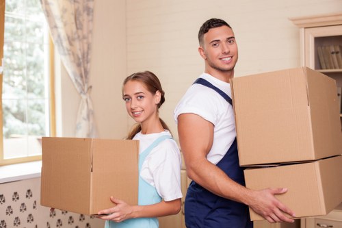 Collection of bulky sofas, beds, and wardrobes in Barnes